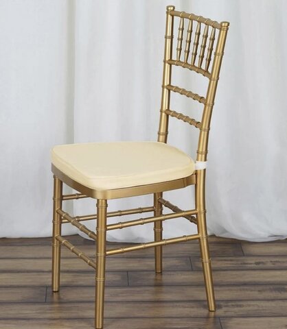 Gold Chiavari chair with ivory cushion