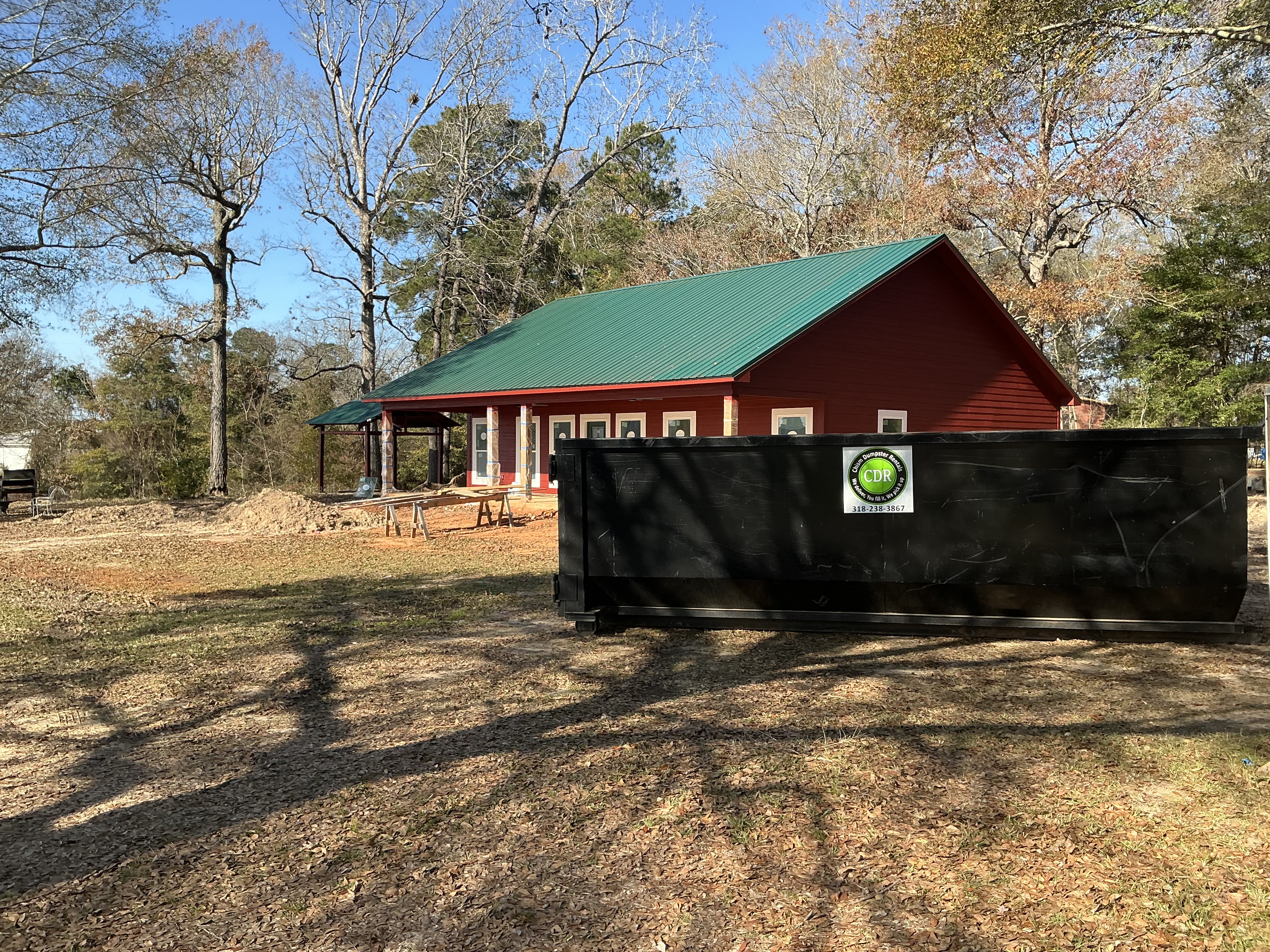 Dumpster placed at a countryside house – Chism Dumpster Rentals Dumpster placed at a countryside house – Chism Dumpster Rentals