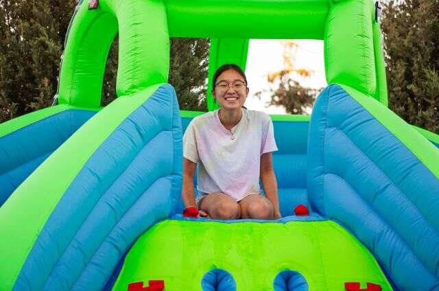 kid enjoying water slide