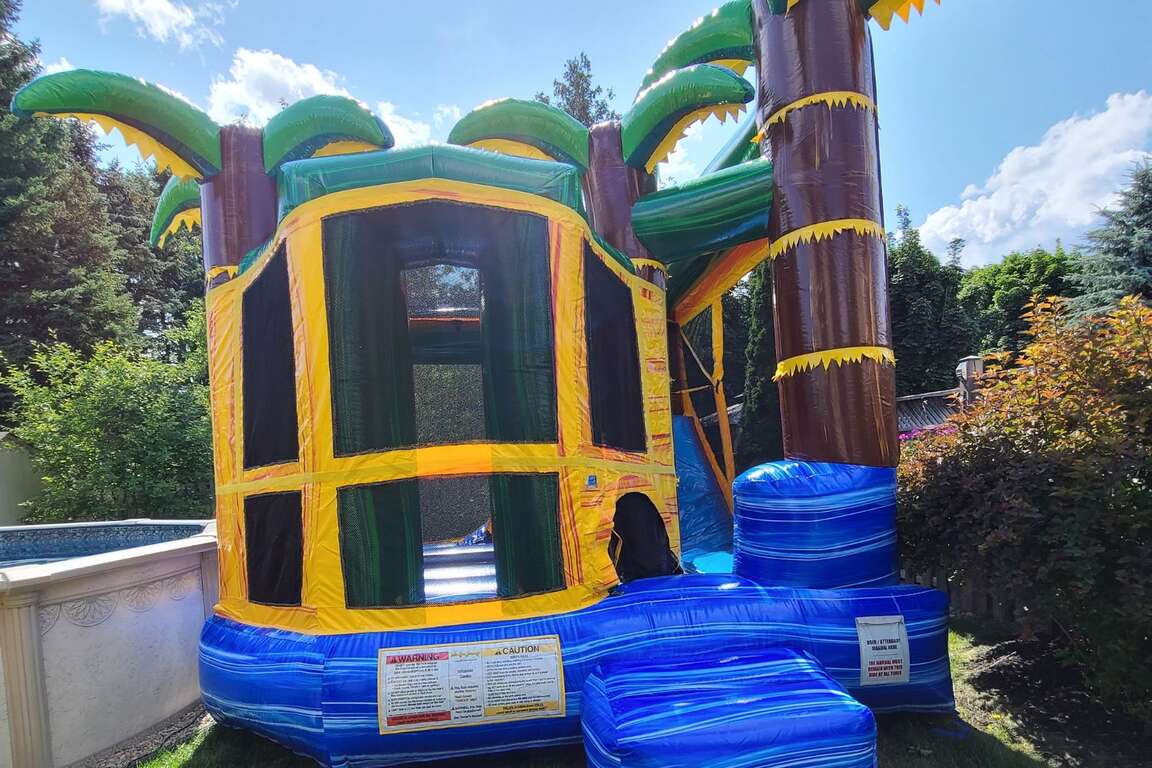 Bouncy castle rentals Brampton combo inflatable with slide climbing wall and basketball hoop for school events corporate events festivals and backyard parties TSSA compliant Castle Kid