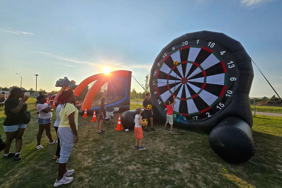 Inflatable game rentals Brampton interactive games including soccer darts basketball shoot and axe throw for corporate events school fun fairs festivals and large crowd entertainment Castle Kid