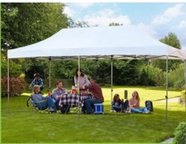 Outdoor tent rental in Boardman, OH with families enjoying shade from Confetti House Rentals.
