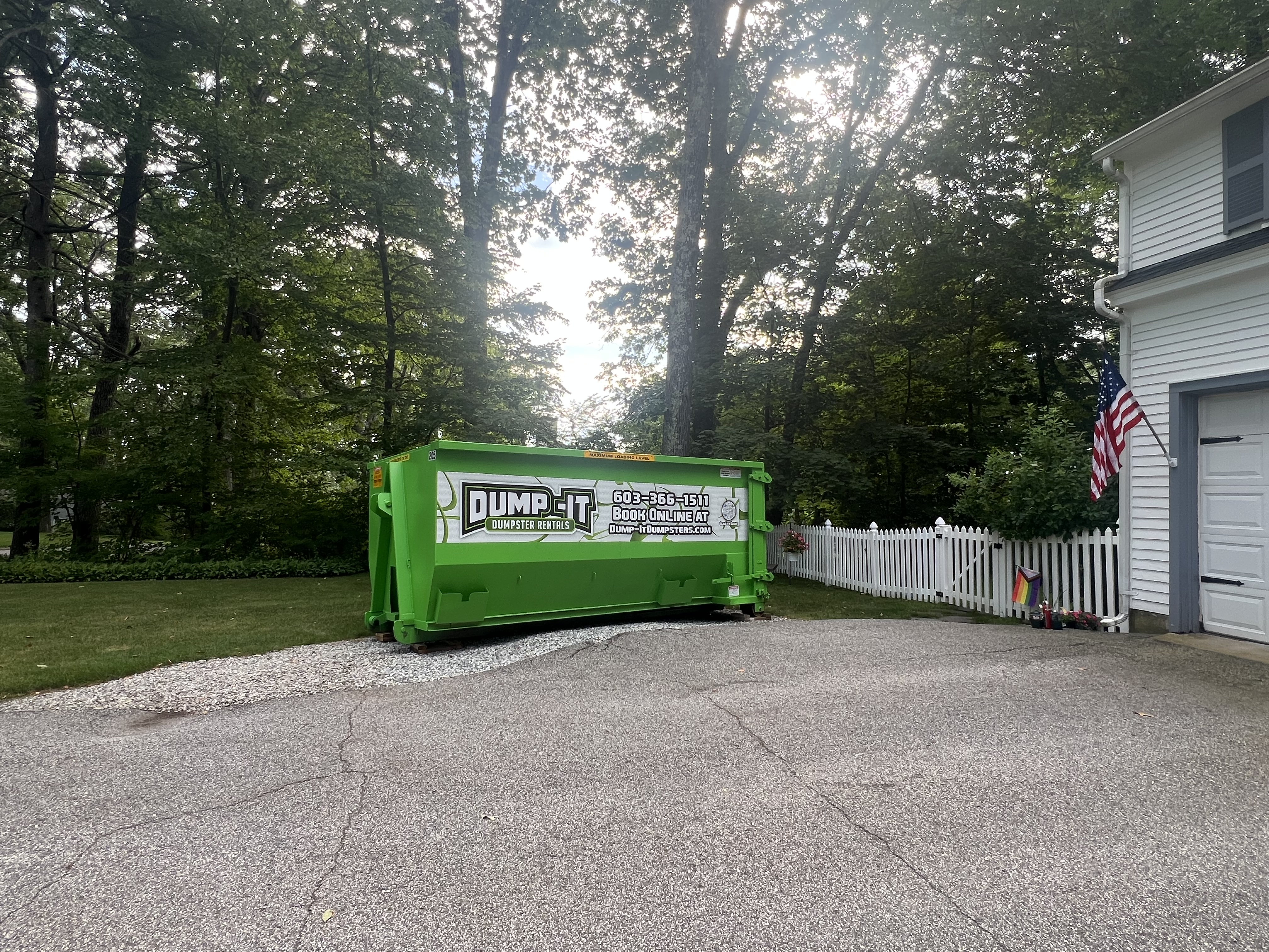 Two dumpsters from Dump-It Dumpster Rentals side by side