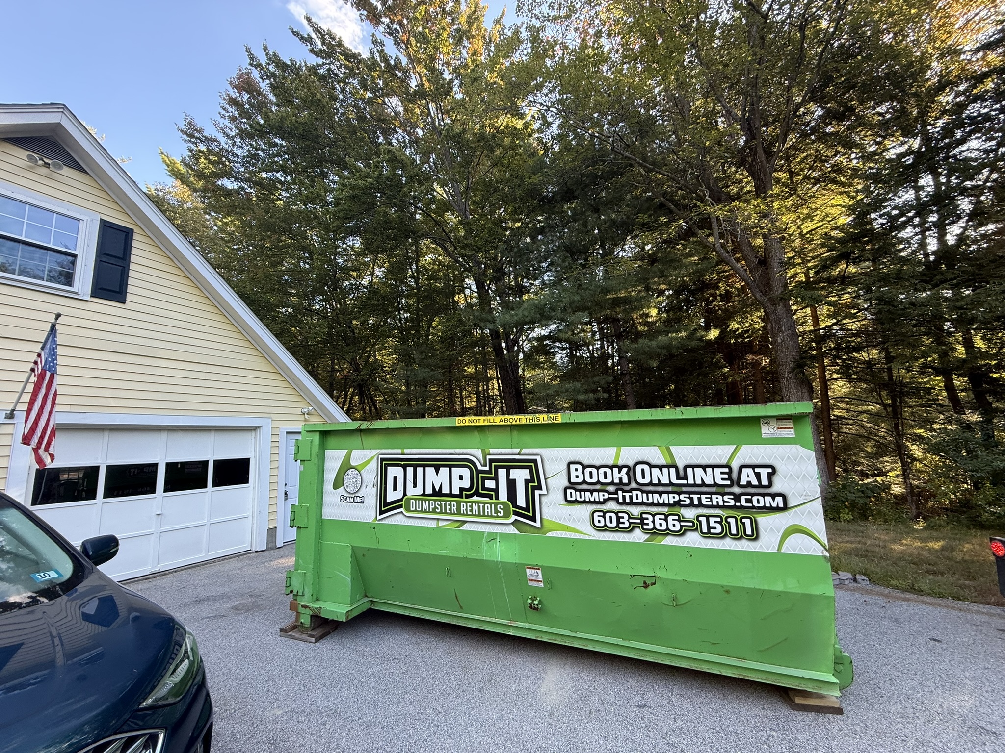 Dump-It Dumpster Rentals" logo over a construction site