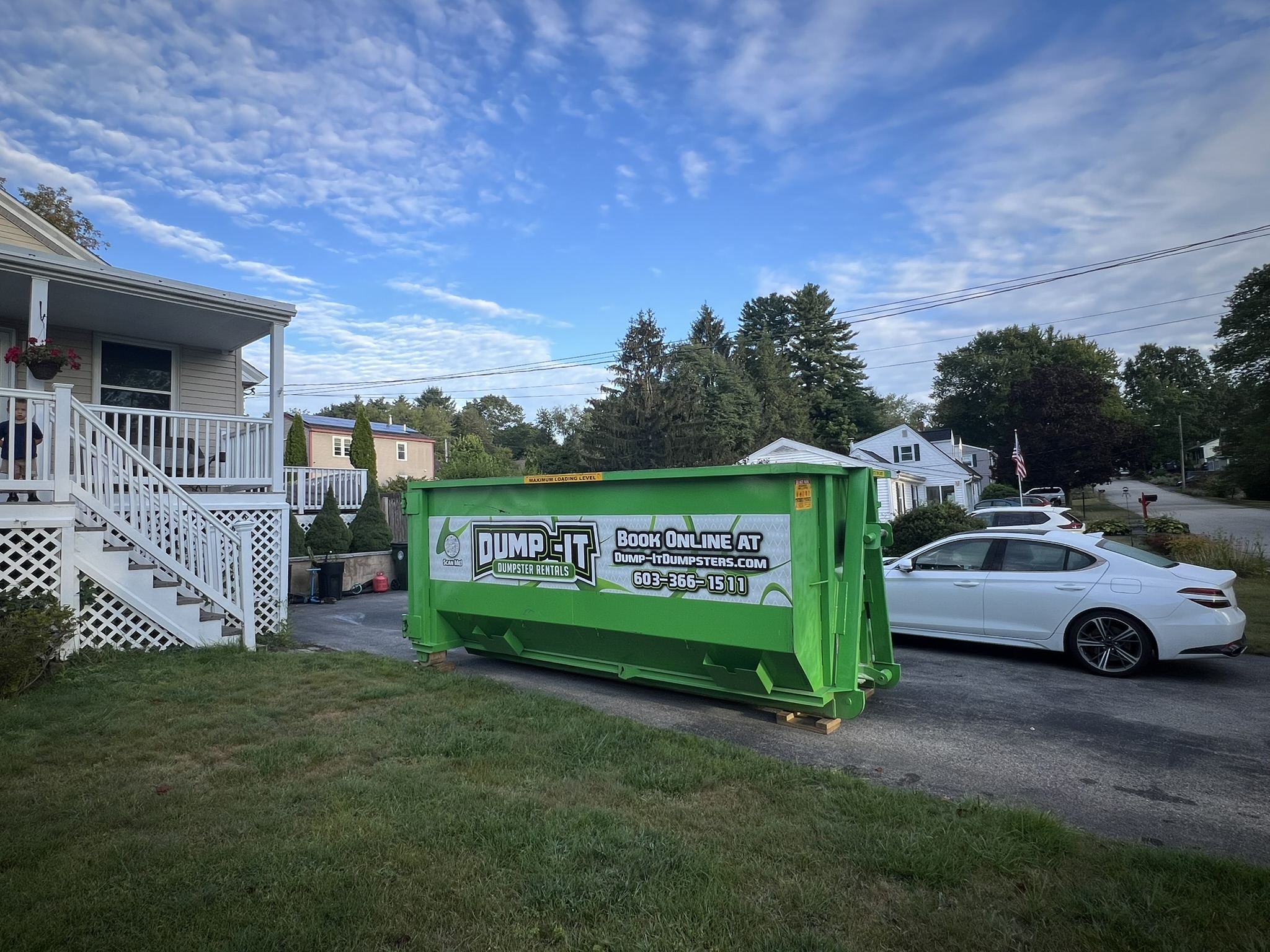Dump-It Dumpster Rentals" logo over a construction site