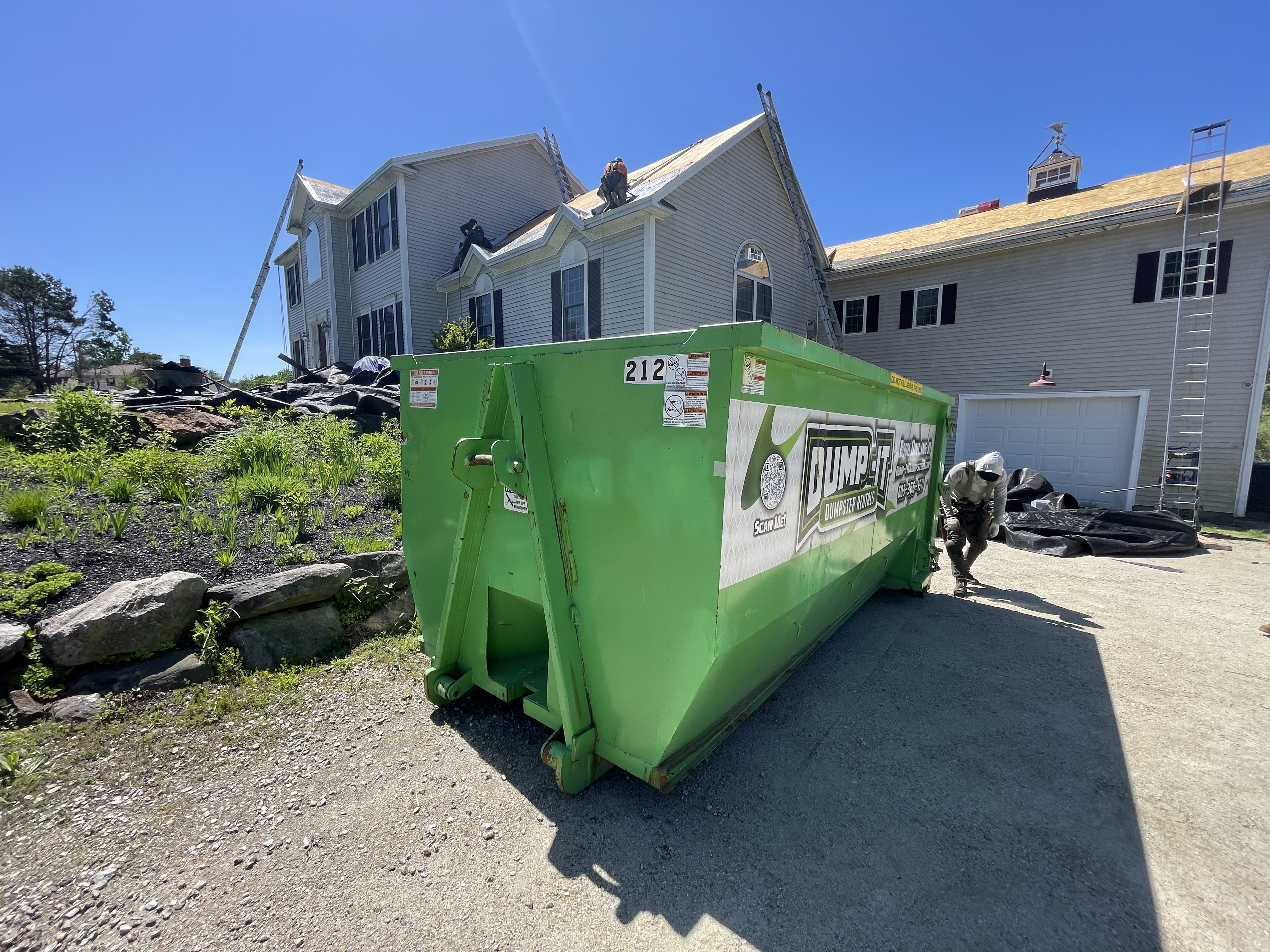 Dumpster from Dump-It Dumpster Rentals at a construction site
