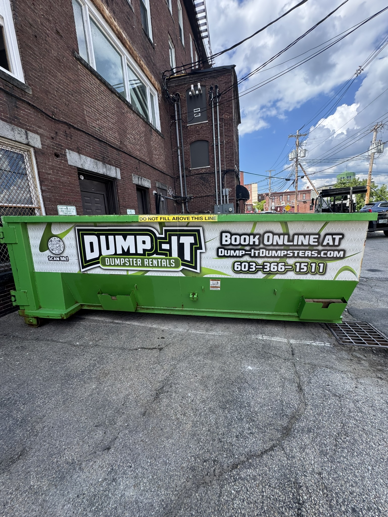 Two dumpsters from Dump-It Dumpster Rentals side by side