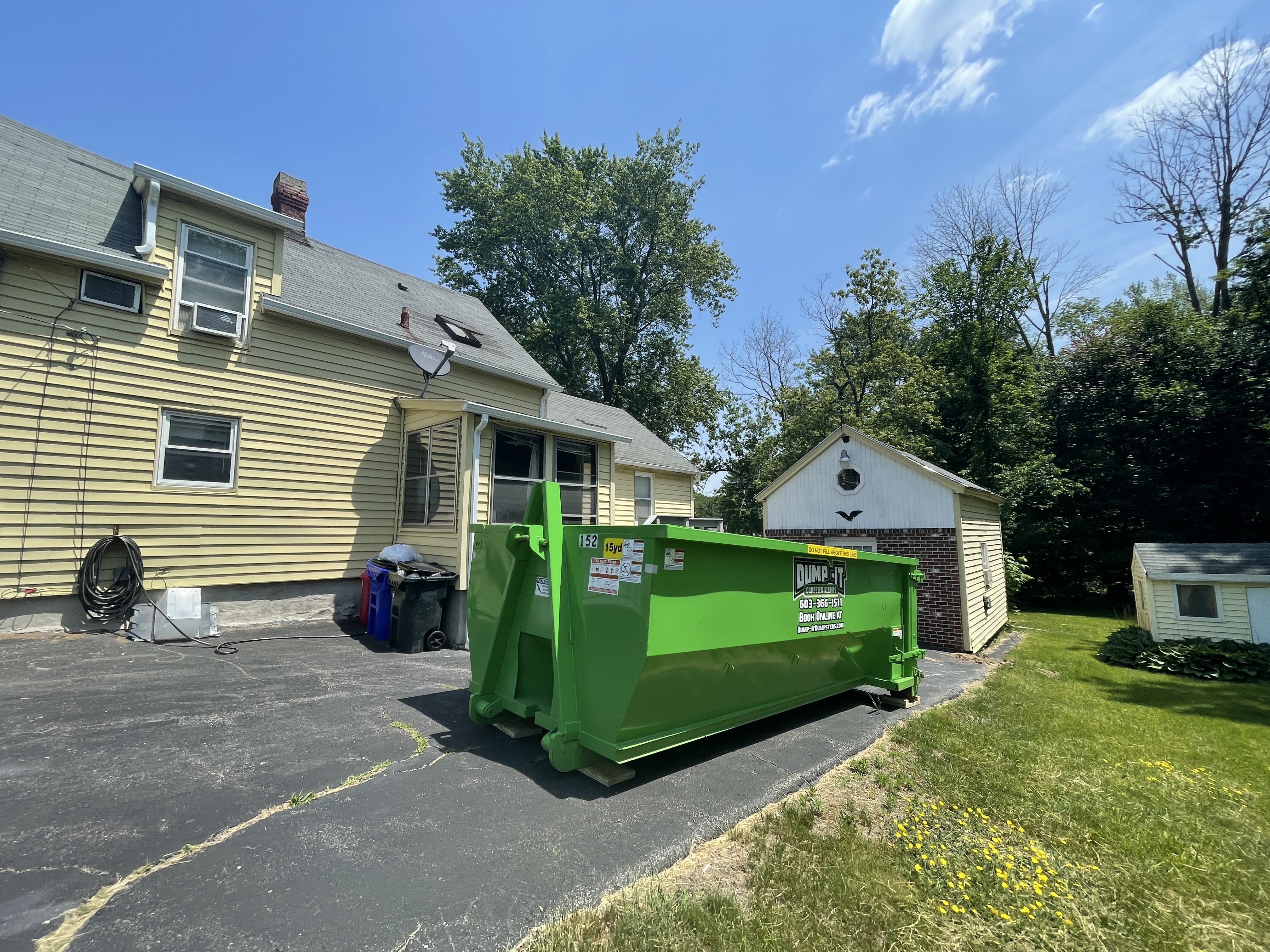 residential house with a dumpster from dump-it dumpster rentals