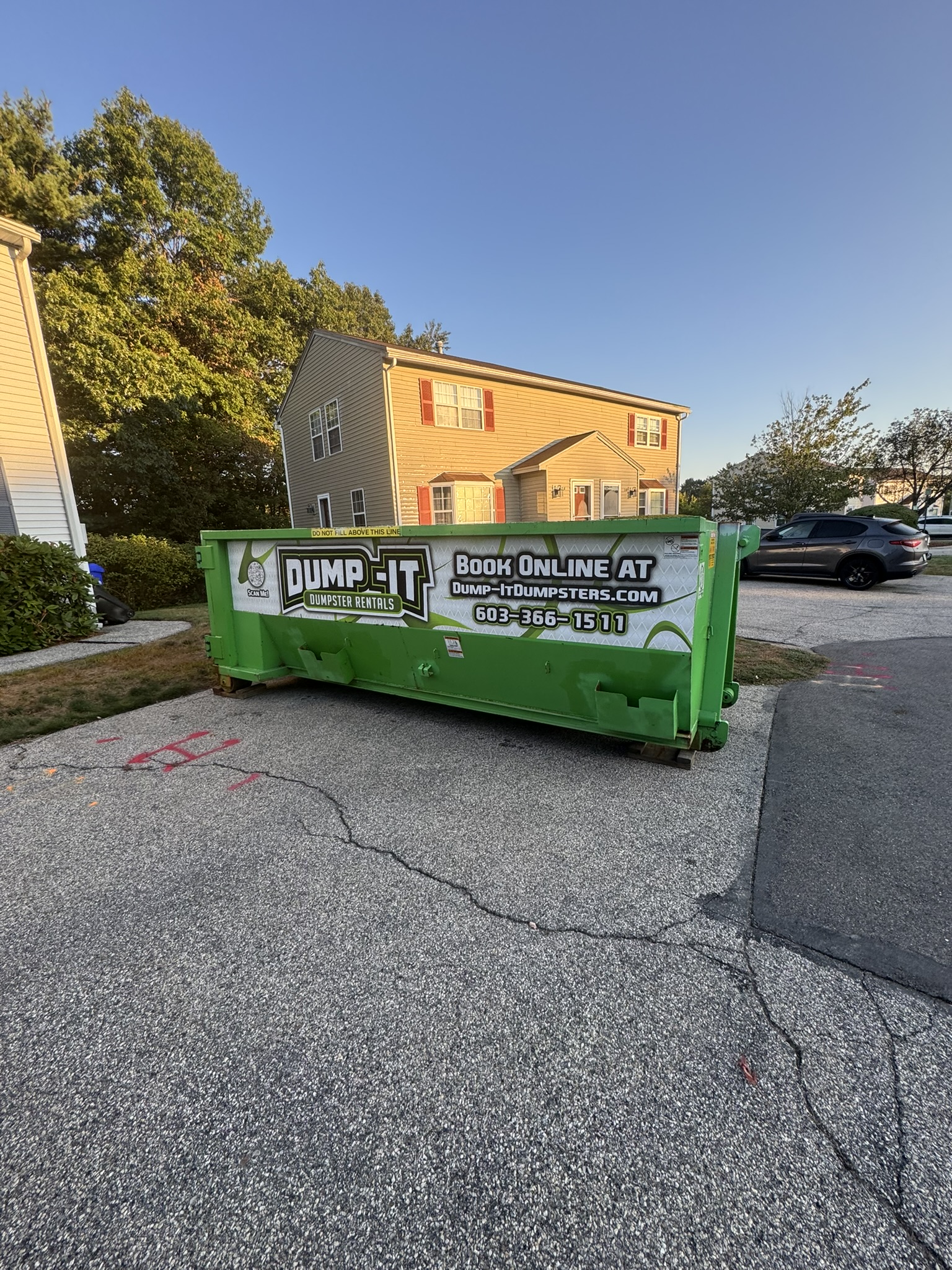 residential house with a dumpster from dump-it dumpster rentals