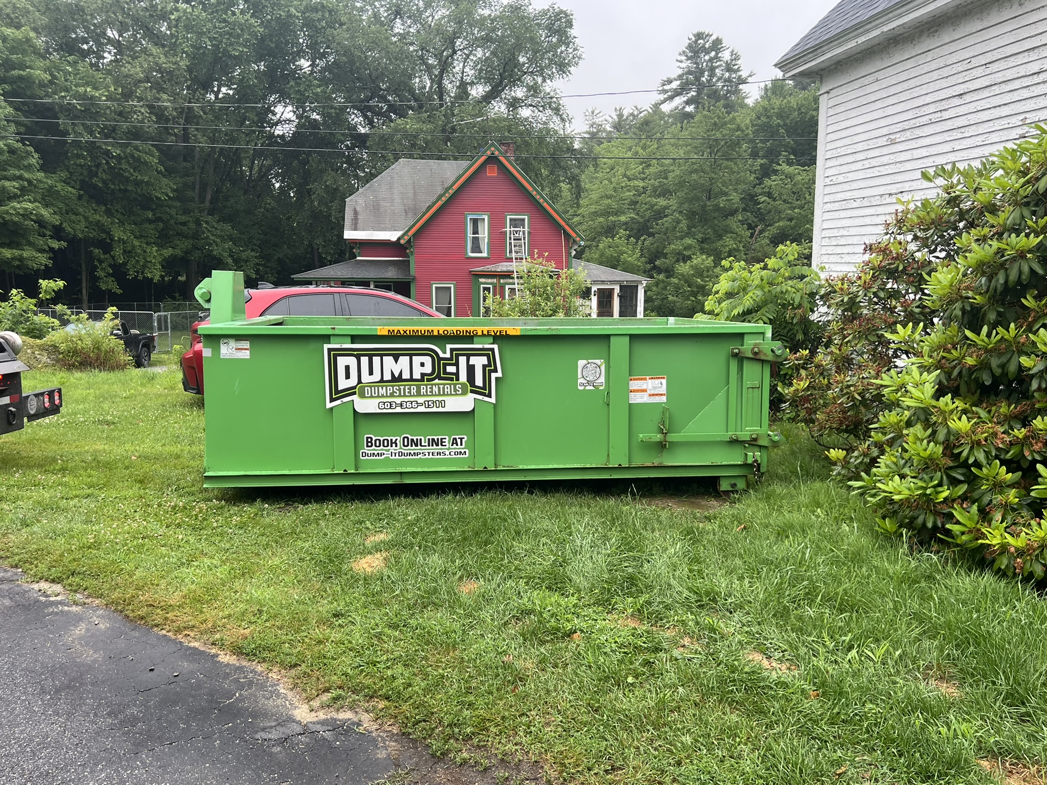 Two dumpsters from Dump-It Dumpster Rentals side by side