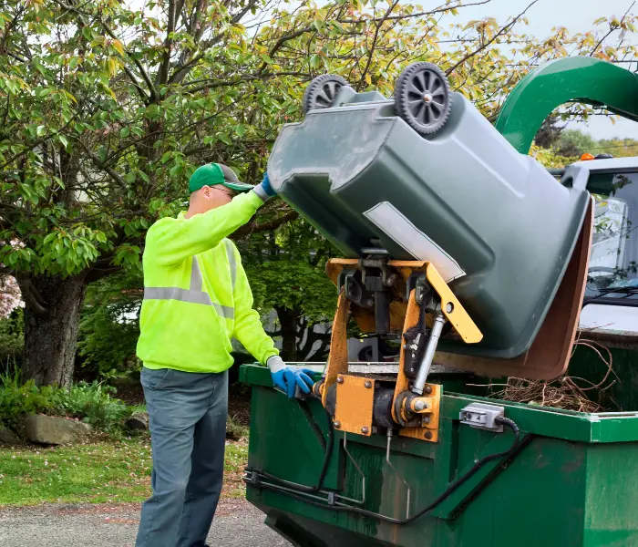 man throwing trash - Dumpster rental Audubon, NJ