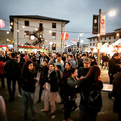 Music | Crowd milling about at a street fair