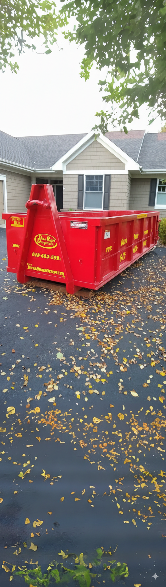 Red roll-off dumpster from Done Right Dumpsters on a residential driveway. Red roll-off dumpster from Done Right Dumpsters on a residential driveway.