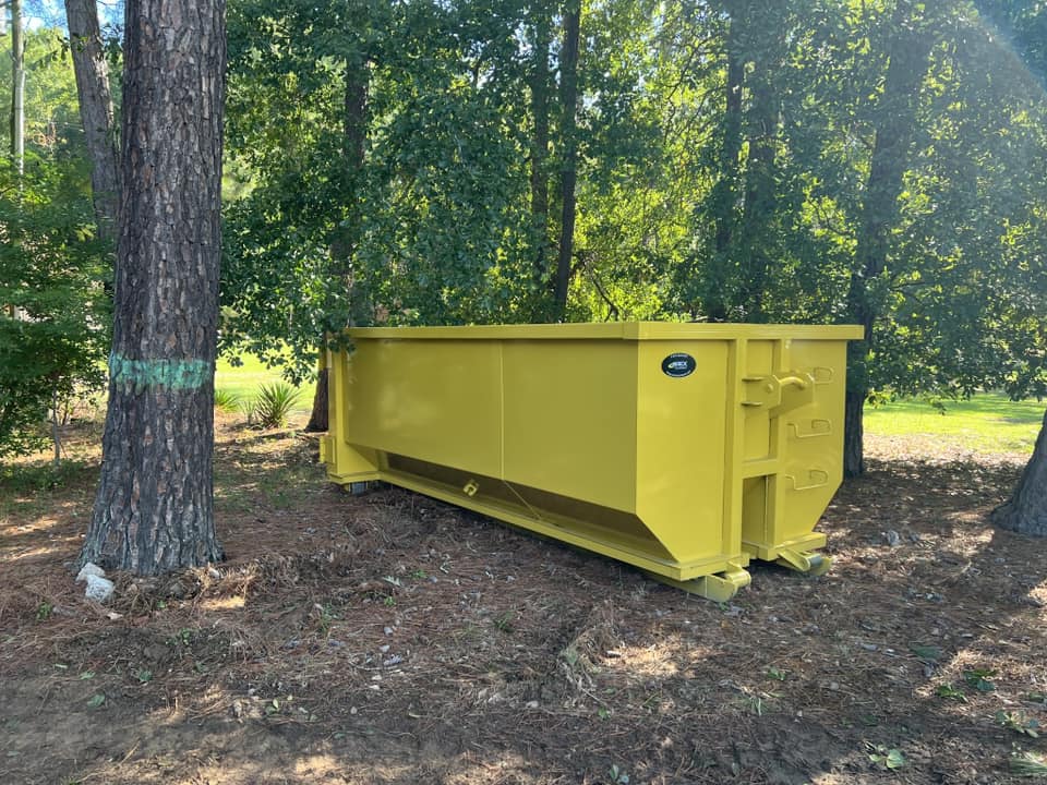 Temporary dumpster in a backyard from Dumpee Dumpster Rentals Temporary dumpster in a backyard from Dumpee Dumpster Rentals