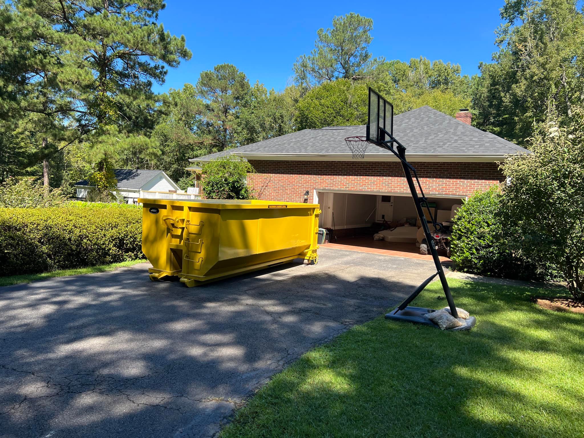 Residential dumpster rental placed in a driveway from Dumpee Dumpsters Residential dumpster rental placed in a driveway from Dumpee Dumpsters