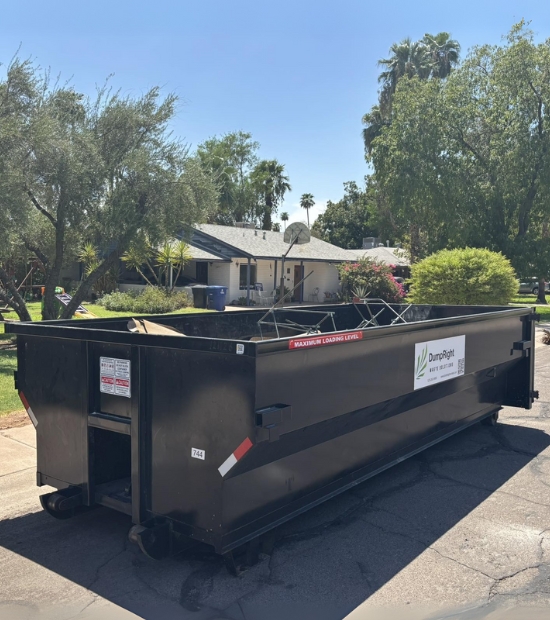 Roll-off dumpster positioned curbside in a residential neighborhood by Dump Right LLC