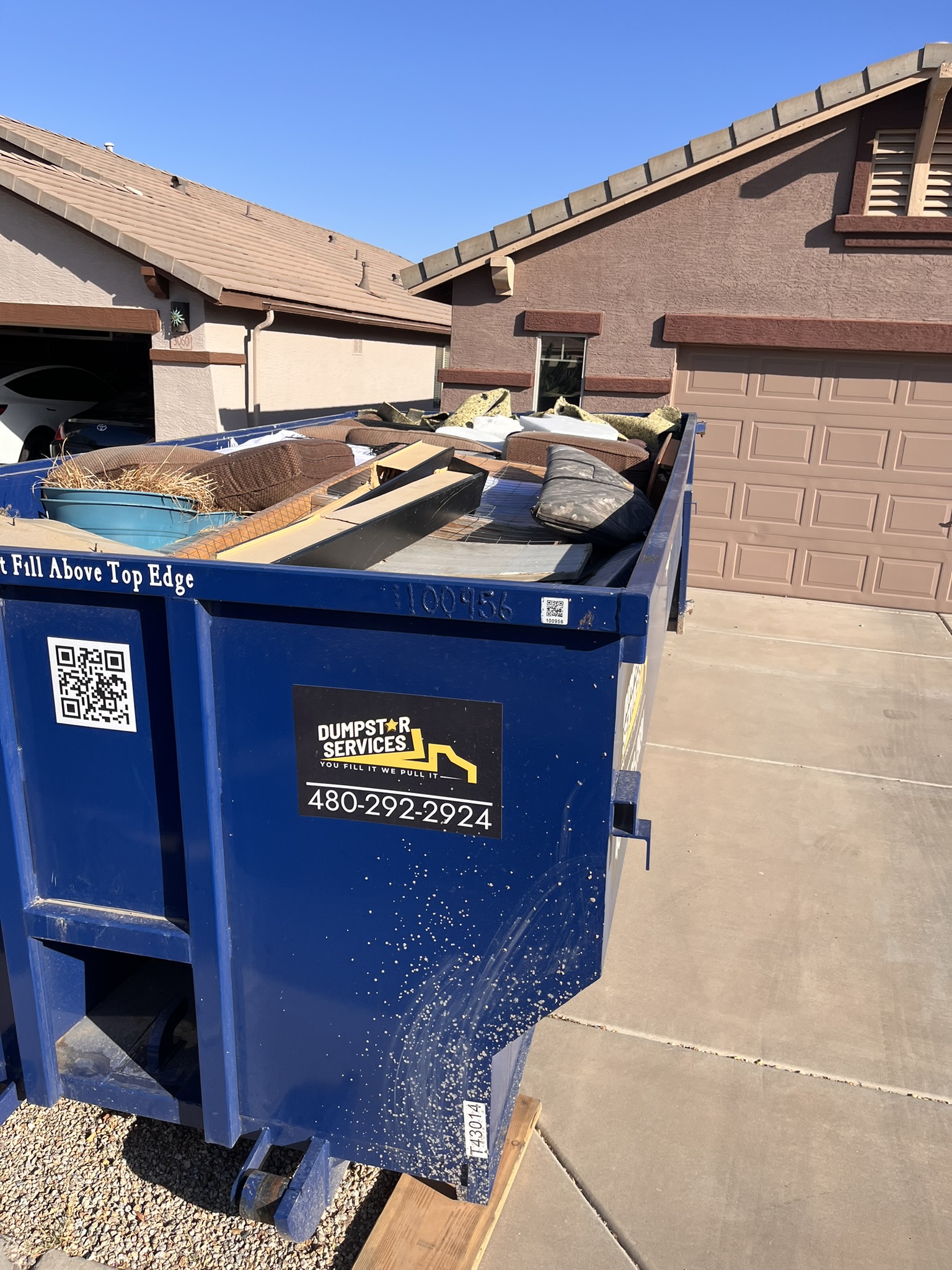 Properly loaded dumpster filled level to avoid overfill and overweight fees