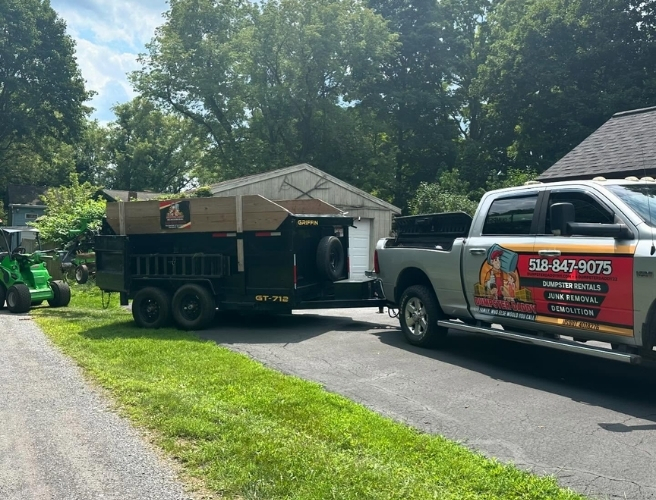Dumpster Daddy truck with trailer for short-term dumpster rentals