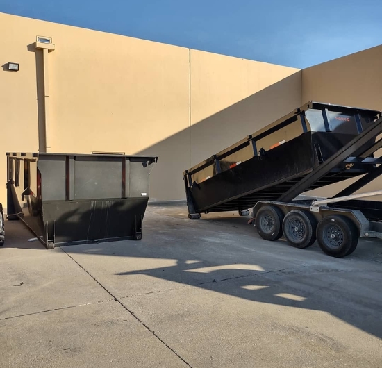 Two Dumpster Supply roll-off dumpsters on site for a commercial cleanout