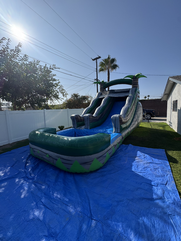Green inflatable water slide at a Menifee summer event