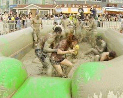 Cleaning and sanitizing bounce houses before rental delivery