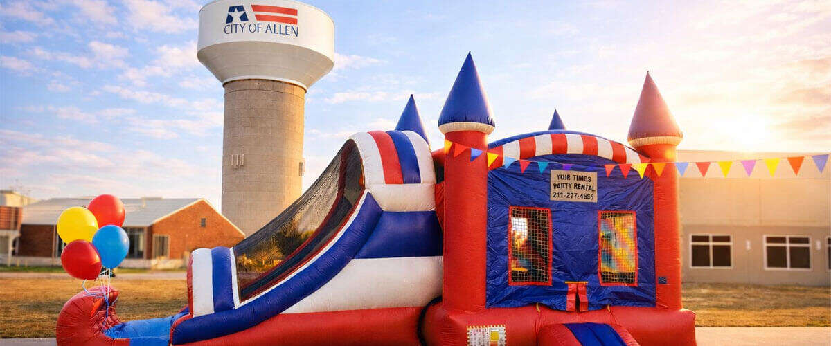 Bounce house rental in Allen TX with Allen water tower in background