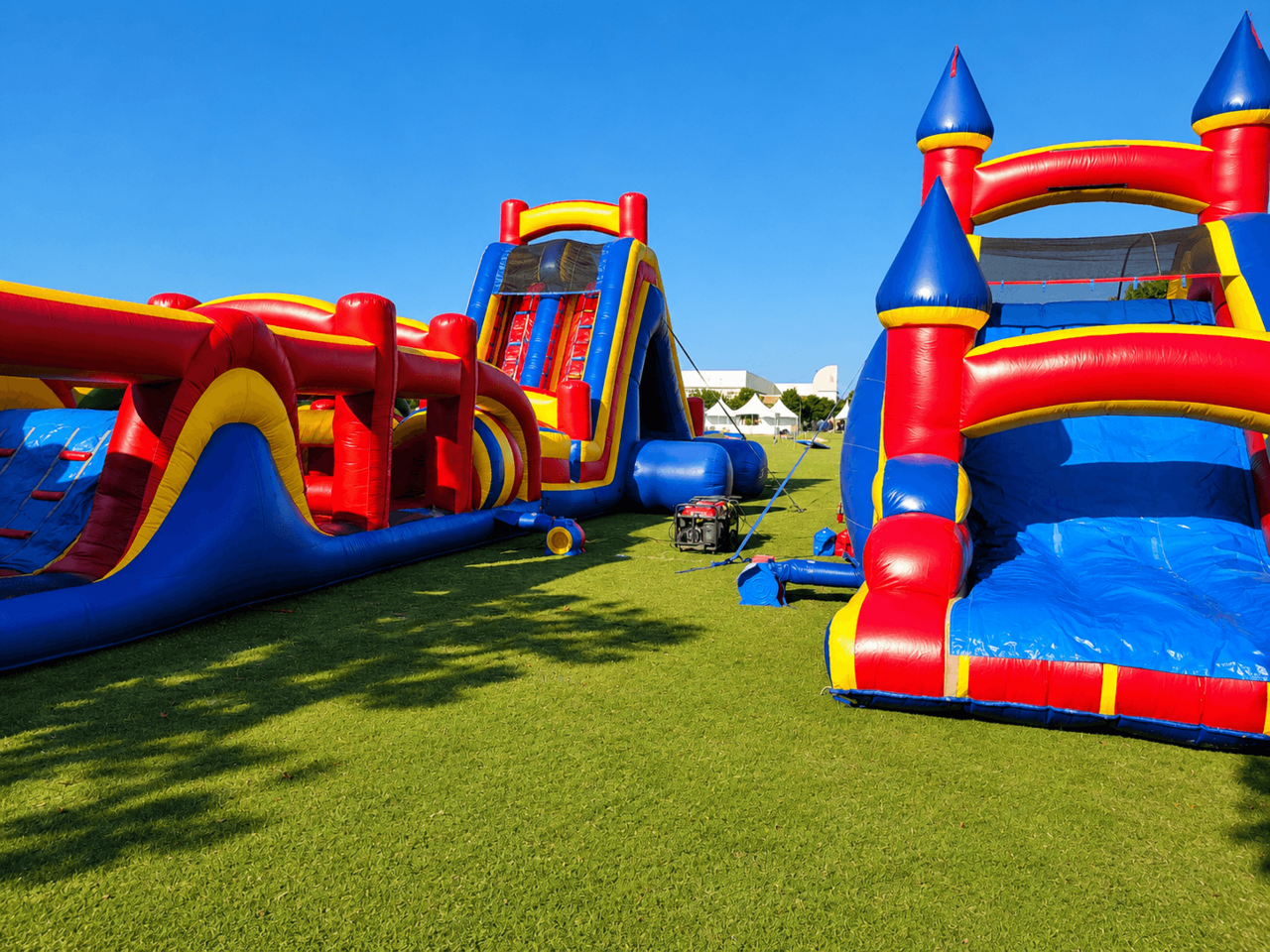 Inflatable obstacle courses and slides at a large community event