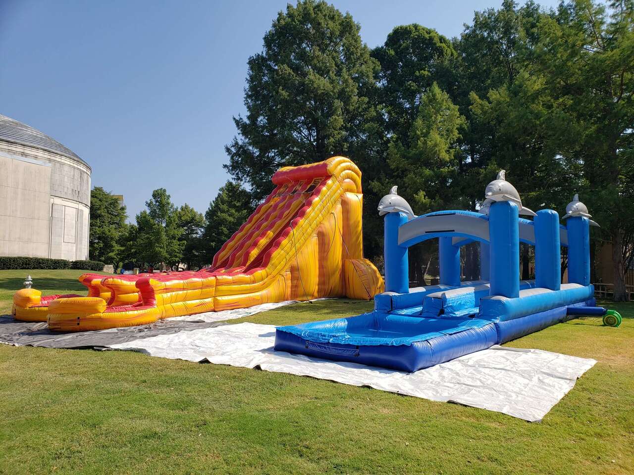 Water slide rentals set up at Fair Park in Dallas Texas for a commercial event