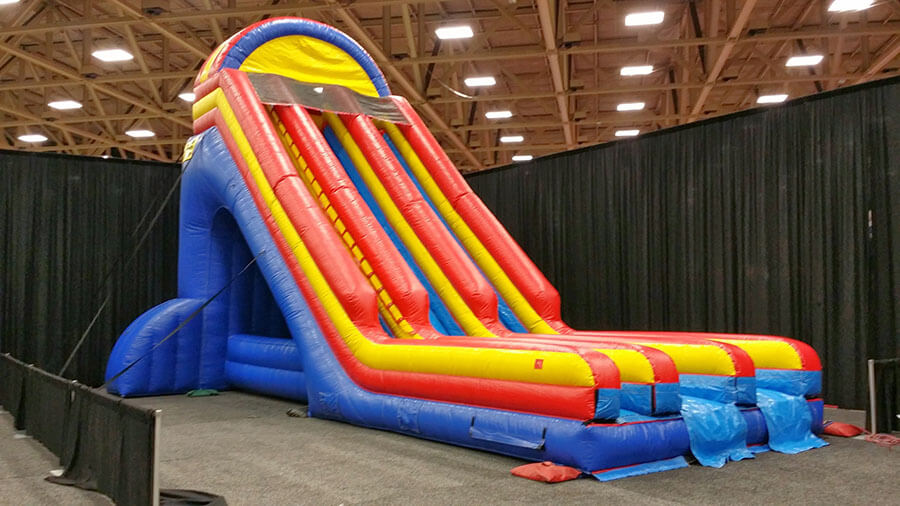 Inflatable dry slide at an outdoor celebration