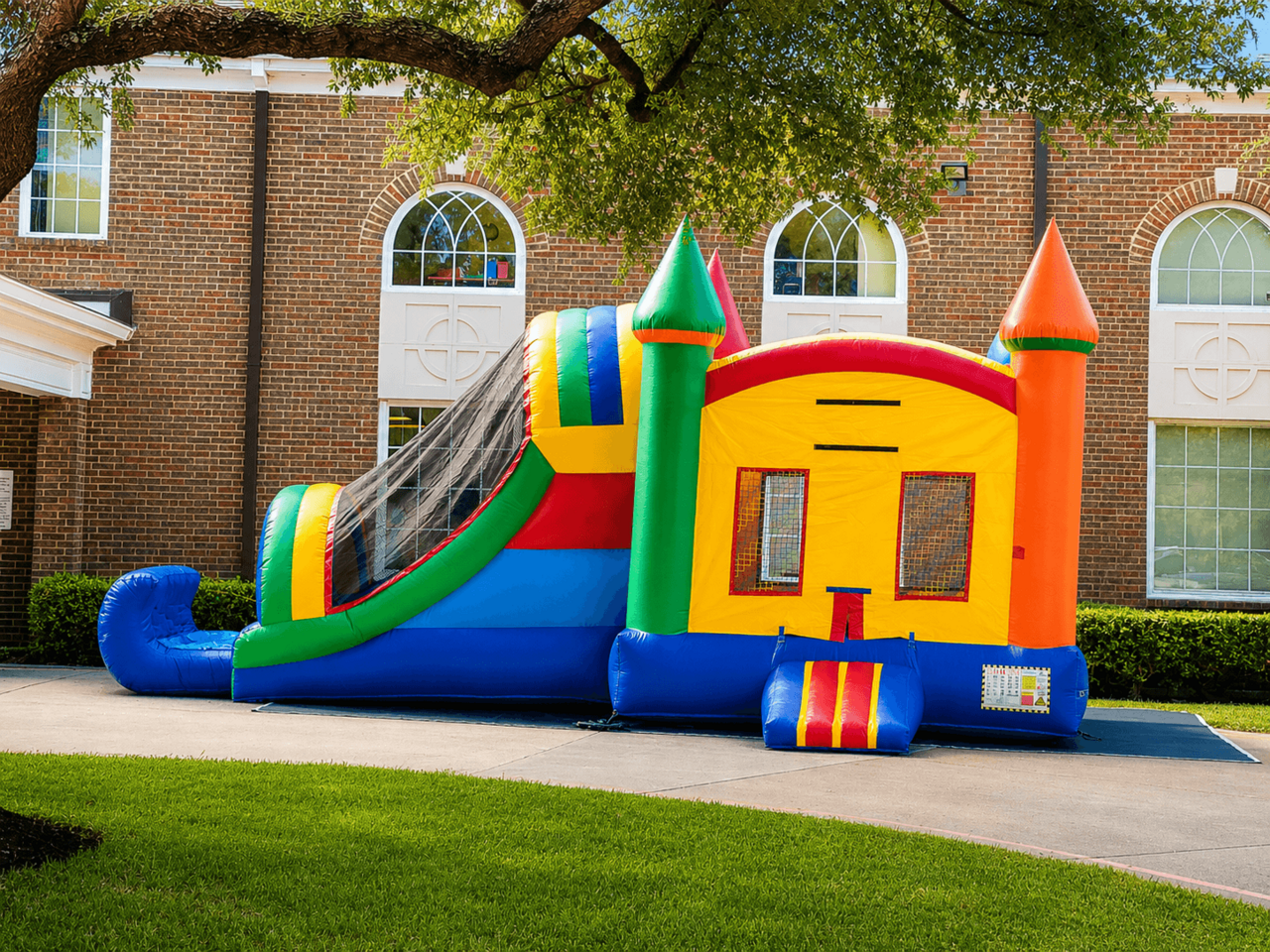 Inflatable bounce house and slide rental for HOA neighborhood event