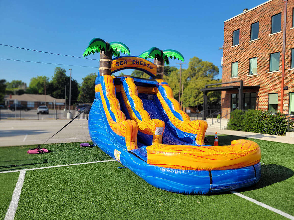Water slide rental set up on turf