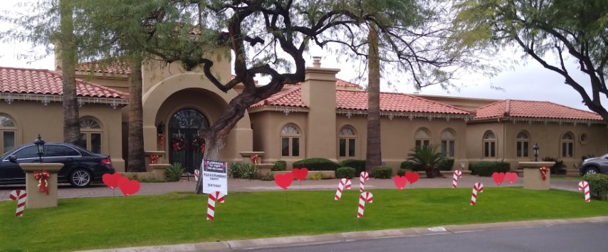 Chridstmas holiday candy canes and hearts yard display