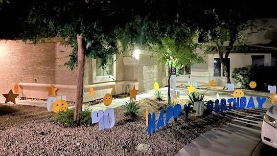 yard sign greeting of happy birthday letters, big number 40s, hearts, smileys & stars near Tempe