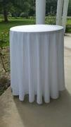 Bistro table with white polyester table cloth
