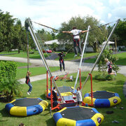 Bungee trampoline with attendant 