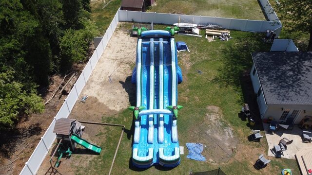 24 foot tall water slide aerial view 2 tropical from fisch inflatables