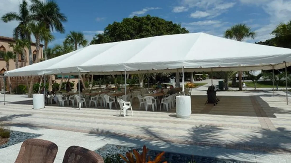 White frame tent set up for an outdoor event