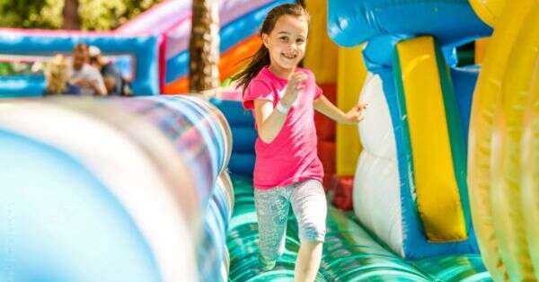 kid on bounce house