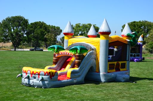 large grey and yellow bounce house inflatable with dinosaur claw graphic