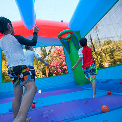 kids bouncing in a bounce house