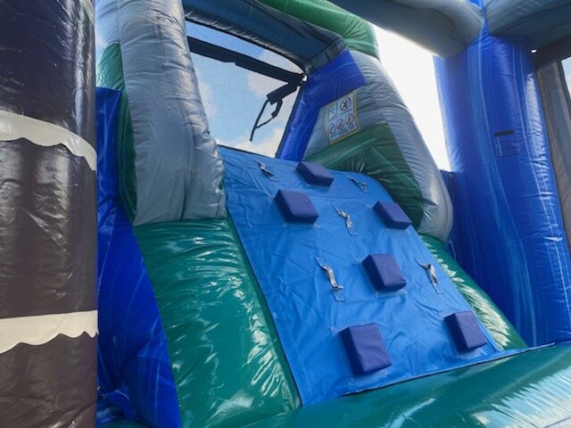 Climbing wall in surfer bounce house
