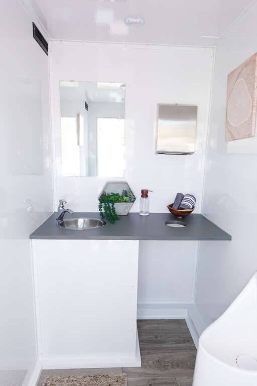 Bathroom trailer vanity with stainless sink, mirror and countertop