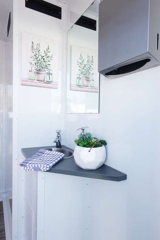 Luxury bathroom trailer sink, mirror and handwashing station