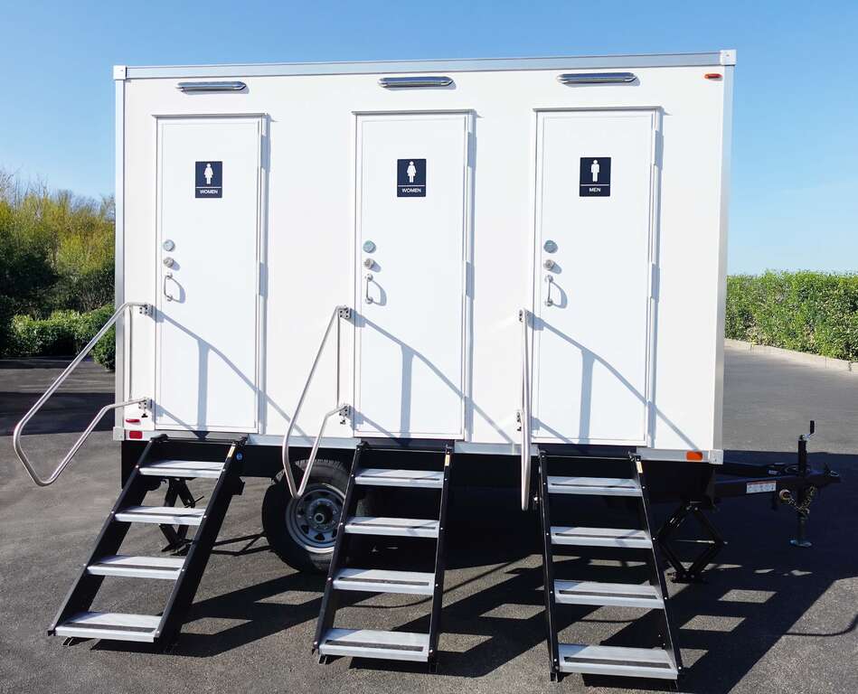 Side elevation of a 3-stall bathroom trailer with three private entrances