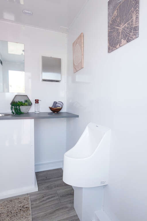 Luxury restroom trailer men's urinal area in Phoenix Arizona