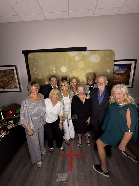 New Year's party photo booth rental in Goodyear AZ with guests posing for a group photo
