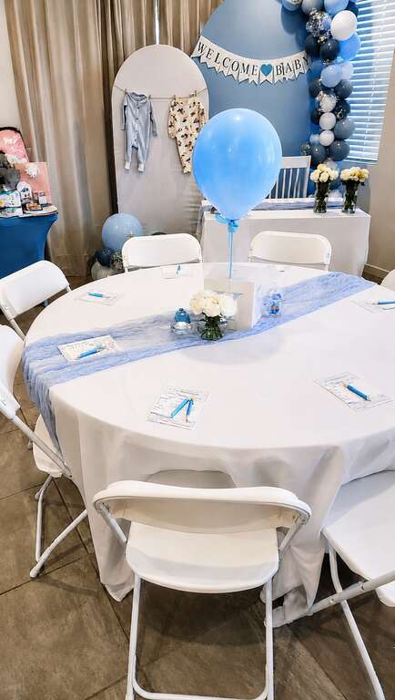 60 inch round table rental with white linen for a baby shower in Goodyear Arizona