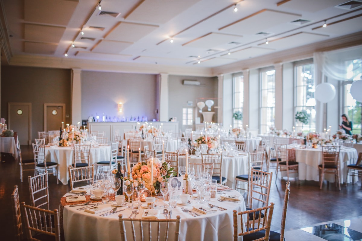 bright reception hall with round tables