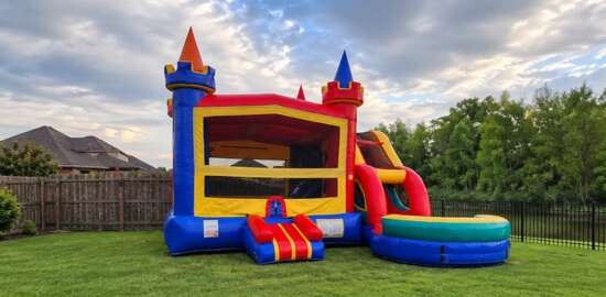 The Mystery Shack inflatable obstacle course rental with a spooky themed design, colorful artwork, and climbing structure displayed outdoors.