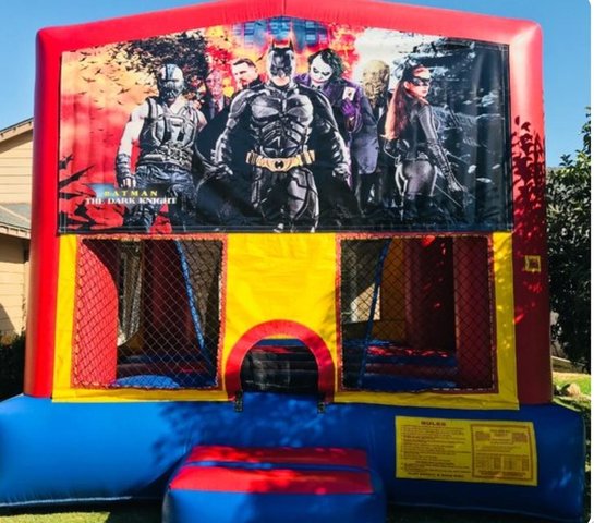 Batman Panel Bounce On A Red And Blue Bounce House / With Basketball Goal